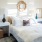 bedroom with ample space around bed, room for a desk and well-lit from natural window lighting